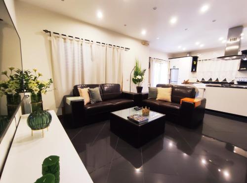a living room with two couches and a coffee table at Casa Da Veiga in Caminha