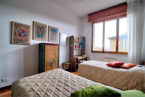 En eller flere senge i et værelse på La Casa di Nilde
