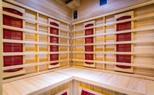 a small sauna with wooden walls and windows at Apartamenty u Stopków in Biały Dunajec