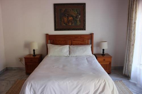 Ένα ή περισσότερα κρεβάτια σε δωμάτιο στο El Palmar Guesthouse
