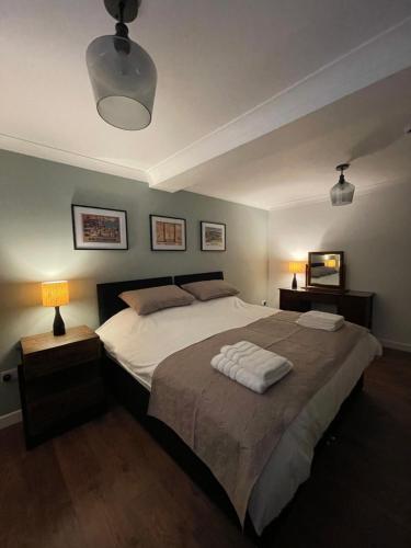 a bedroom with a large bed with two pillows on it at Kittiwake Number 4A - Town Centre Ground Floor in Bridlington