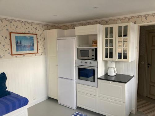 Una cocina o zona de cocina en Grindstugan Högbo