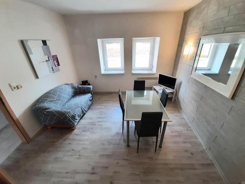 a living room with a table and a couch at Townhouse for fitters / Haus für Monteure in Schraplau in Schraplau