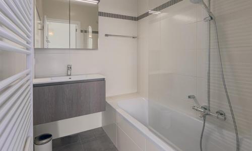 a bathroom with a shower and a tub and a sink at WILCÉ 07/0302 in Sint-Idesbald