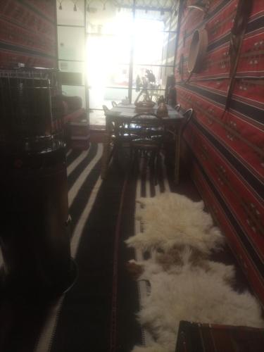 a room with a pile of sheep laying on the floor at Its your choice hostel in Wadi Musa