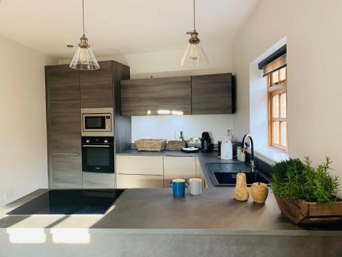 a kitchen with stainless steel appliances and wooden cabinets at 16 St Martins near to Steep Hill in Lincoln
