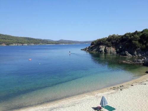 a view of a beach with a sandy shore at Kis-Kis in Metókhion Ayías Kiriakís