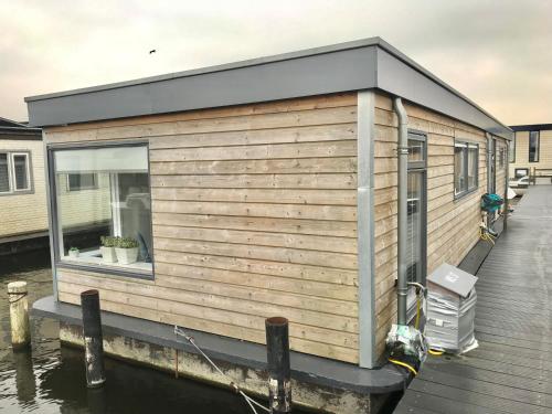 a tiny house on a dock on the water at Quiet Waterloft near Amsterdam and Schiphol WS17 in Aalsmeer