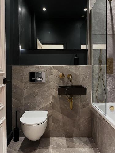 a bathroom with a toilet and a sink at Luxury 2 Bedroom Flat in Central Todmorden in Todmorden