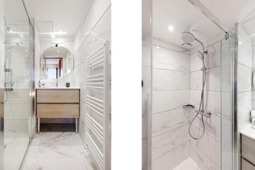 une salle de bain blanche avec une douche et un lavabo dans l'établissement Citybeach SOHA- Rue d'Antibes - 2 BdR 2 BthR 1 toil - Clim Terrace Parking Elevator, à Cannes