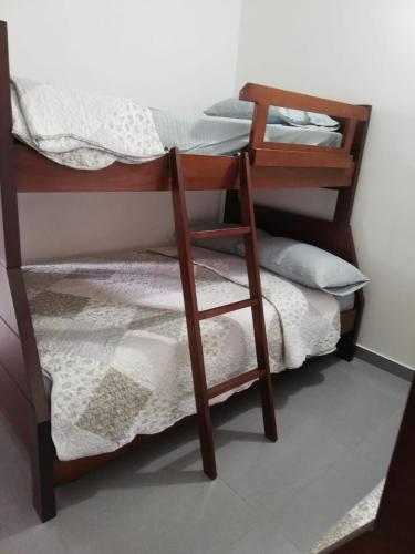 a pair of bunk beds in a room at Casa Campestre Altamira in Los Curos