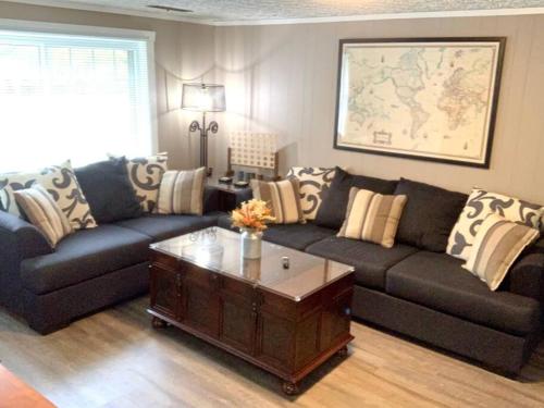 a living room with a couch and a coffee table at The House Hotels- E. Turkeyfoot #1 in Akron