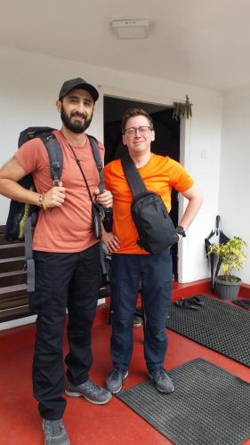 two men standing next to each other on a red carpet at KPL Holiday Homes in Hatton