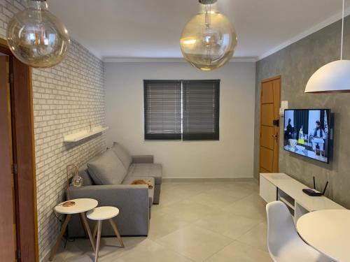 Televisyen dan/atau pusat hiburan di Apto 1o andar novo 2 Dorm - próximo ao centro