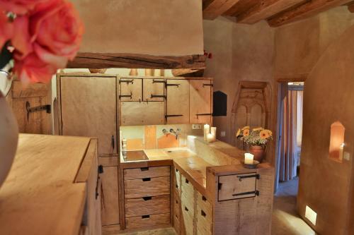 a kitchen with wooden counters and a counter top at Turm zu Schloss Schedling in Trostberg an der Alz