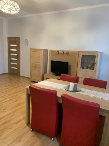 Televízia a/alebo spoločenská miestnosť v ubytovaní Apartament Second Home