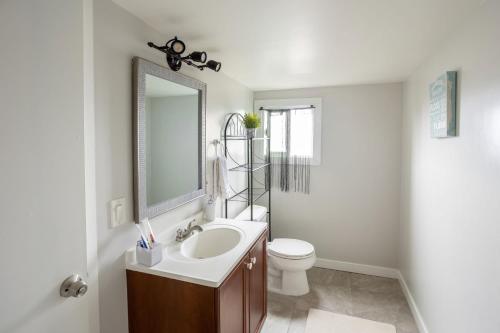 a bathroom with a sink and a toilet and a mirror at Special Studio in Center of San Diego in San Diego