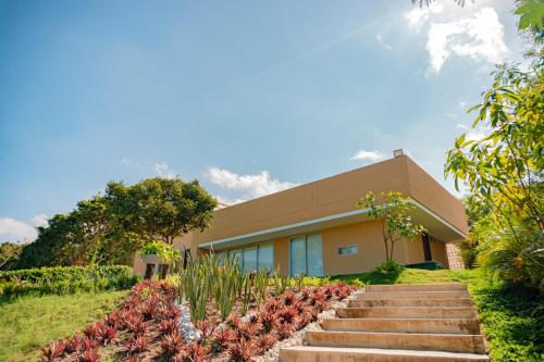 a building with stairs in front of it at Hotel Explore Caño Dulce in Tubará
