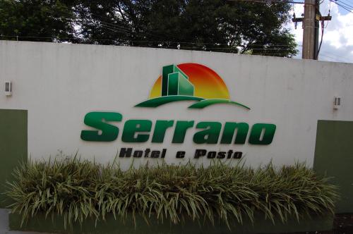 a sign for a hotel and casino at Hotel Serrano in Frederico Westphalen