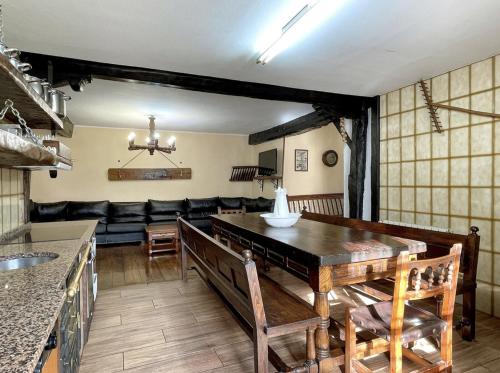 a living room with a table and a couch at Casa Rural Iratxeko-Berea in Bera