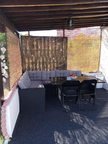 a living room with a couch and a table at House Relic in Veli Iž