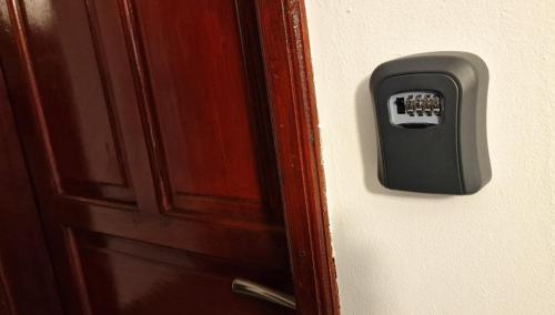 a close up of a door knob on a door at Valea Albă View - SELF CHECK-IN in Buşteni