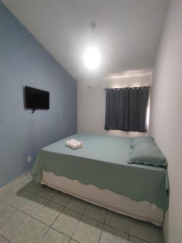 Postel nebo postele na pokoji v ubytování Pousada Encanto dos Mares
