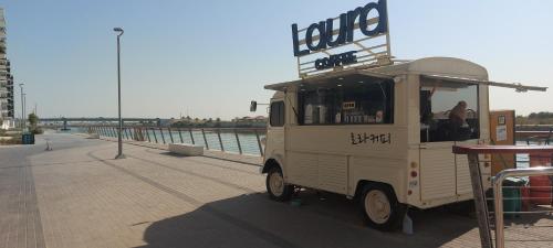 a food truck parked next to the water at Deluxe Apartment on YAS with Sea View Balcony in Abu Dhabi