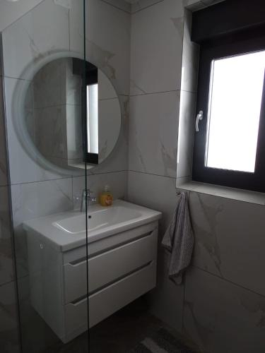 Ένα μπάνιο στο Apartman Dabrović