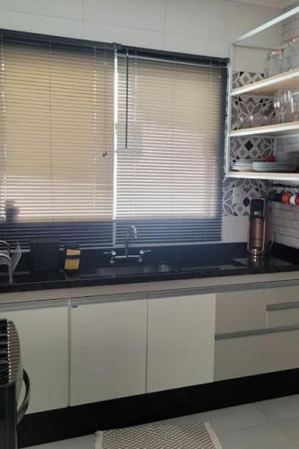 Dapur atau dapur kecil di Apto 1o andar novo 2 Dorm - próximo ao centro