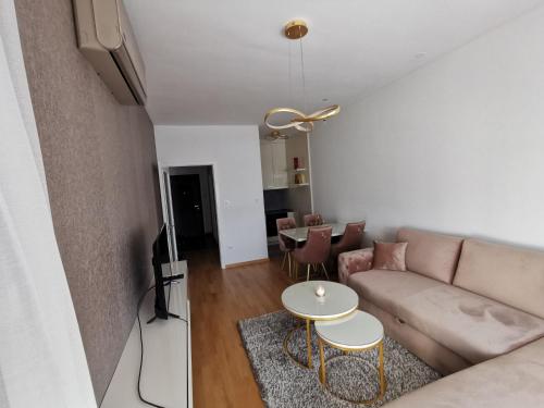 a living room with a couch and a table at Alex LUX in Banja Luka