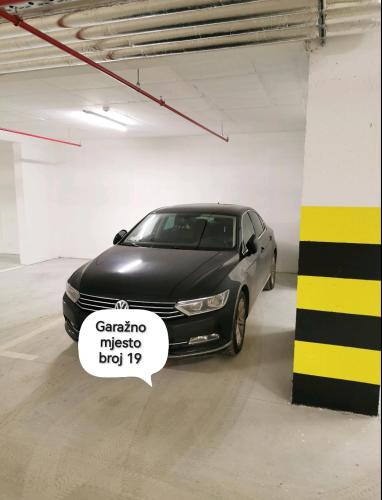 a car parked in a garage with a sticker on it at Alex LUX in Banja Luka