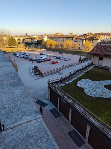 a view of a parking lot with cars parked in a parking lot at Il Tarassaco in Busca