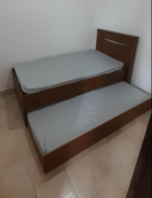 Cama en habitación con 2 camas en Casa compartilhada acesso por escada equivalente a 5 andares, en Río de Janeiro