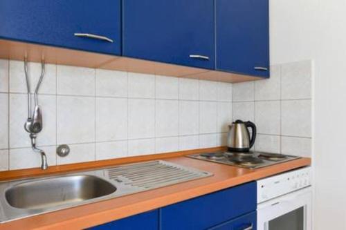 Kuchyň nebo kuchyňský kout v ubytování Apartments Pero