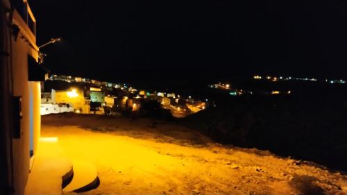 a view of a city at night with lights at Casa Morisca in Sidi Ifni