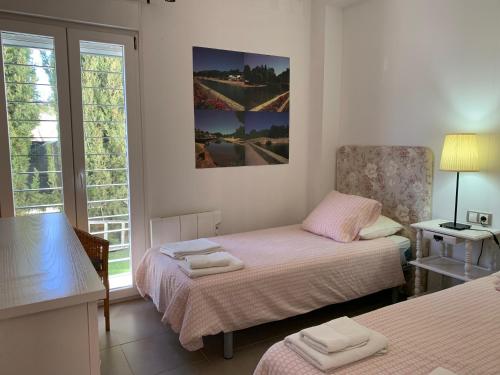 Ένα ή περισσότερα κρεβάτια σε δωμάτιο στο Casa Rural Nacimiento del Huéznar - Tomillo 23