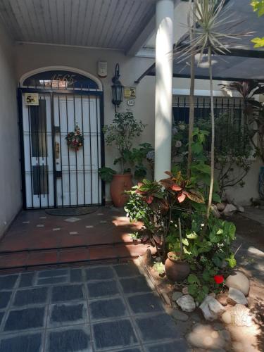 an entrance to a house with a gate and plants at Comfort Suite in Vicente López