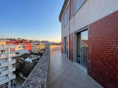 a balcony of a building with a view of a city at B&B - Private Rooms in Tirana
