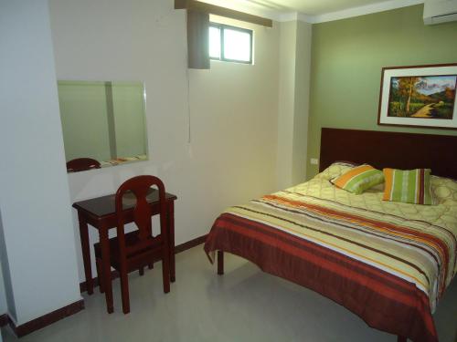 Giường trong phòng chung tại Sol Del Sur Hotel