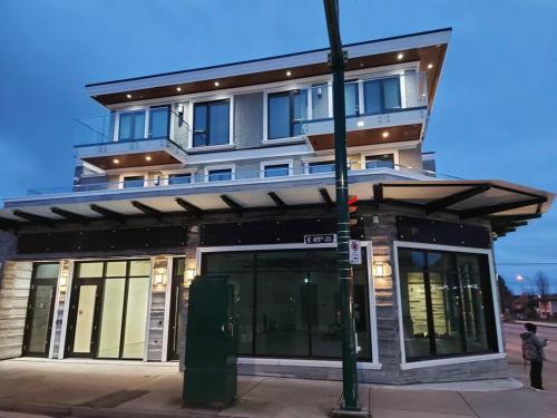 a building on the corner of a street at Beautiful Bright 3 Bed Townhouse in Vancouver
