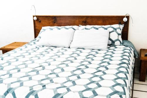 Postel nebo postele na pokoji v ubytování Hotel Allende
