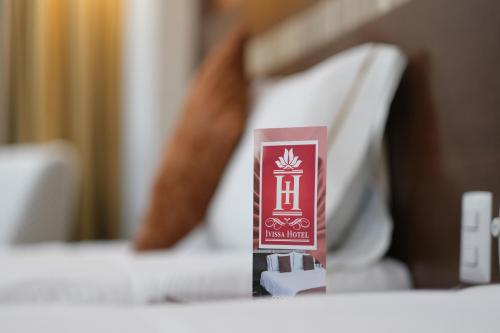 Postel nebo postele na pokoji v ubytování Ivissa Hotel