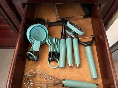 a box filled with cooking utensils and a whisk at Playa Bonita 4 minute walk from our private Villa Anantara Bonita in Las Terrenas