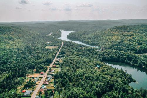an aerial view of a river and a road at Auberge Mandala in Saint Mathieu Du Parc