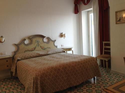 Posteľ alebo postele v izbe v ubytovaní Hotel Lidomare