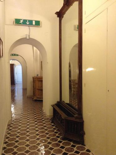 a mirror sitting on a floor in a hallway at Hotel Lidomare in Amalfi