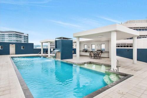 a large swimming pool on top of a building at Townsville City Ocean View Apartment in Townsville