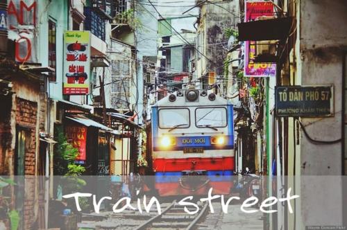a train is traveling down a city street at Homestay#Hoàn Kiếm#NiceRoom#GoodPrice in Hanoi