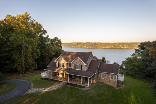 an aerial view of a house with a lake at River Haven with Hot Tub in Delta